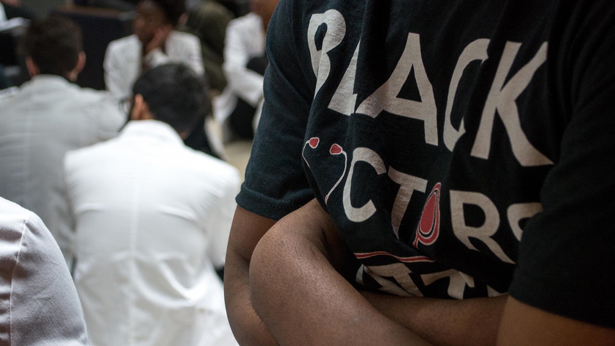 person wearing a t-shirt that says black doctors